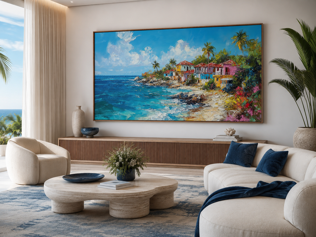Large canvas wall art of a colorful Dominican Republic coastal village above a wooden sideboard.