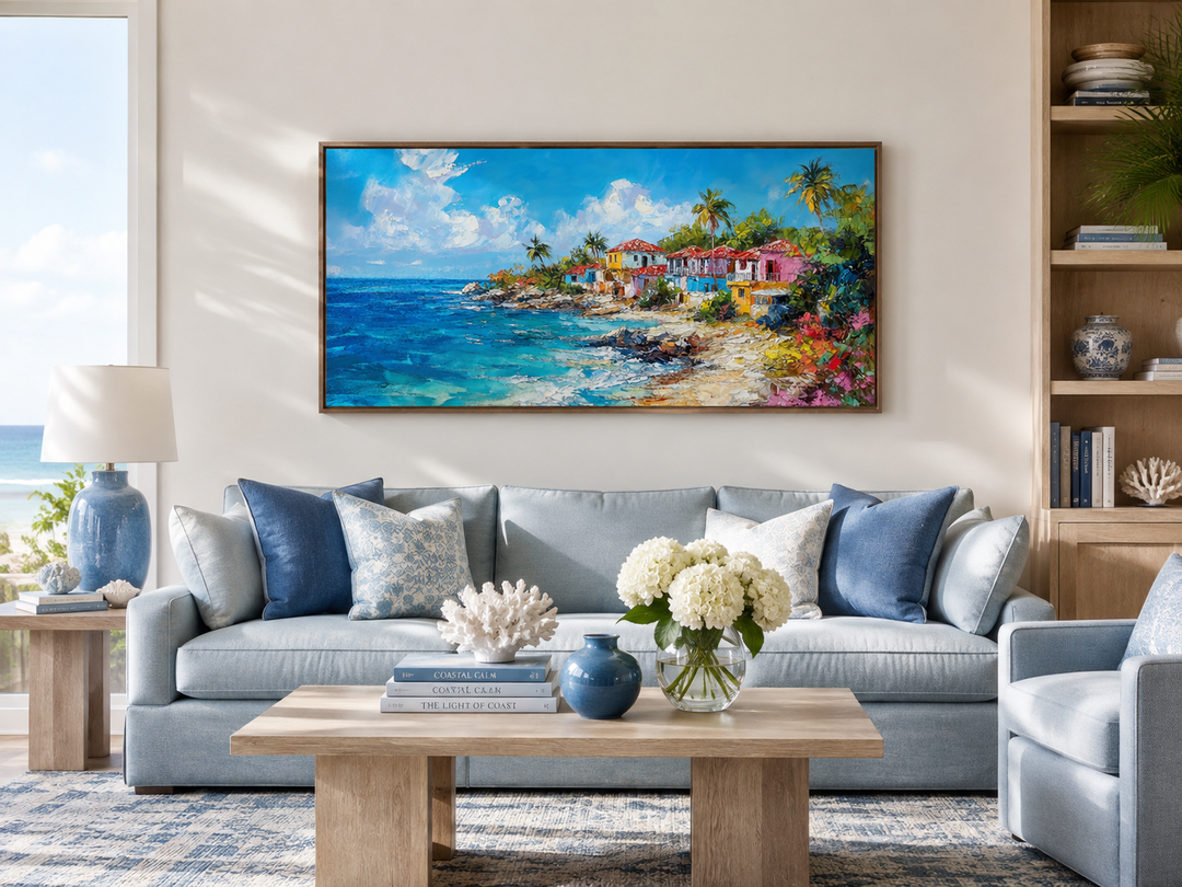 Dominican Republic beach painting canvas wall art above a blue sofa in a coastal living room.