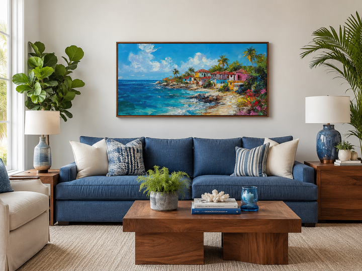 Dominican Republic beach painting canvas wall art above a blue sofa in a coastal living room.