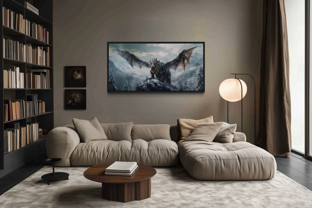 Framed dragon canvas wall art above a beige sofa in a modern living room with a bookshelf.