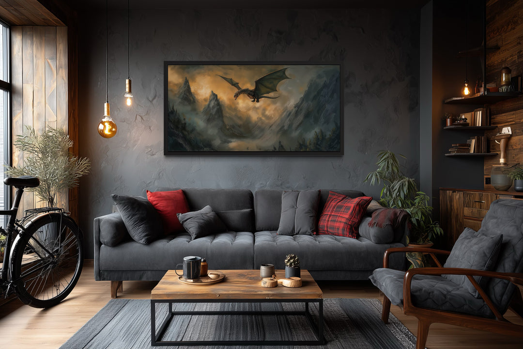 Framed panoramic canvas wall art of a dragon flying over mountains in a dark living room.