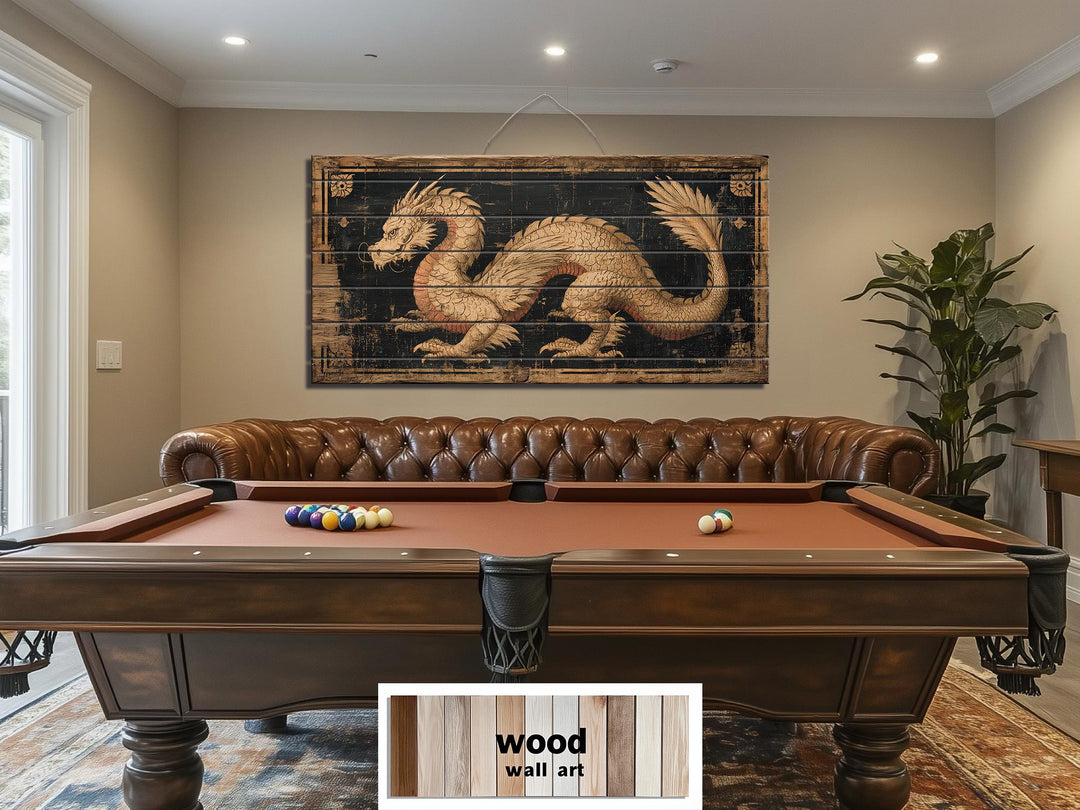 Horizontal distressed wood wall art featuring a golden dragon above a pool table and leather sofa.