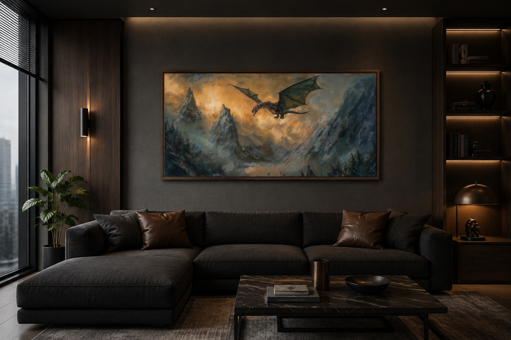 Framed panoramic canvas wall art of a dragon flying over mountains above a dark sofa in a room.