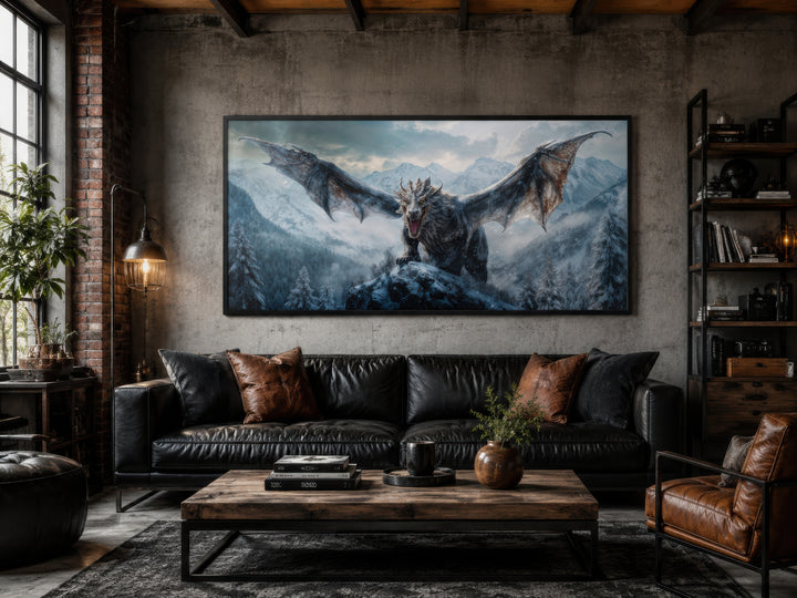 Framed dragon canvas wall art above a black leather sofa in a rustic man cave or game room.