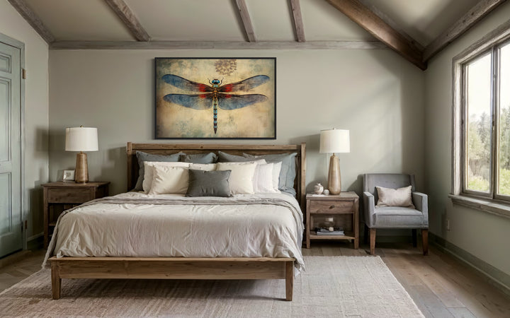Dragonfly Vintage Rustic Framed Canvas Wall Art hanging above a wooden bed in a cozy bedroom.