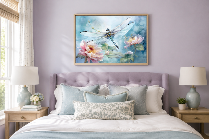 Framed watercolor wall art of a dragonfly on flowers above a bed in a lavender bedroom.