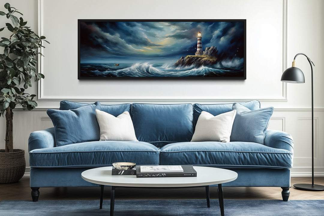 Panoramic wall art of a lighthouse in a stormy ocean above a blue sofa in a modern living room.