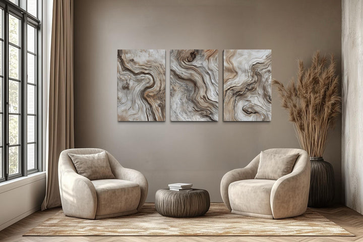 A triptych of vertical canvas wall art featuring abstract driftwood grain patterns in a modern room.