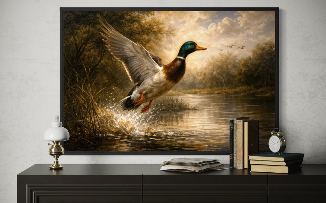 A framed canvas print of a mallard duck in flight over a river, styled as rustic cabin wall decor.