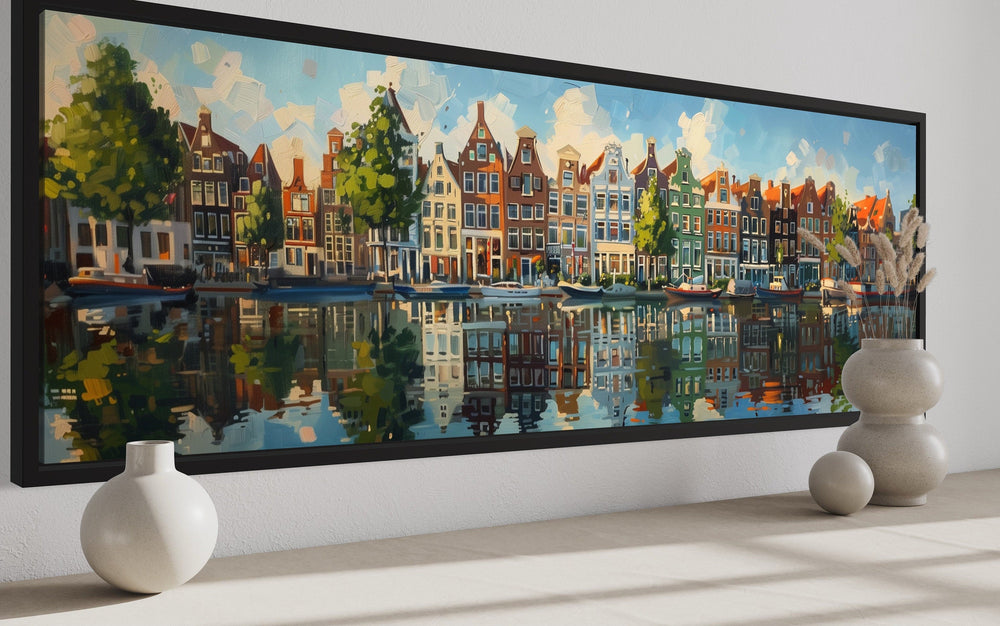 Panoramic framed canvas wall art of colorful Dutch houses reflecting in a canal.