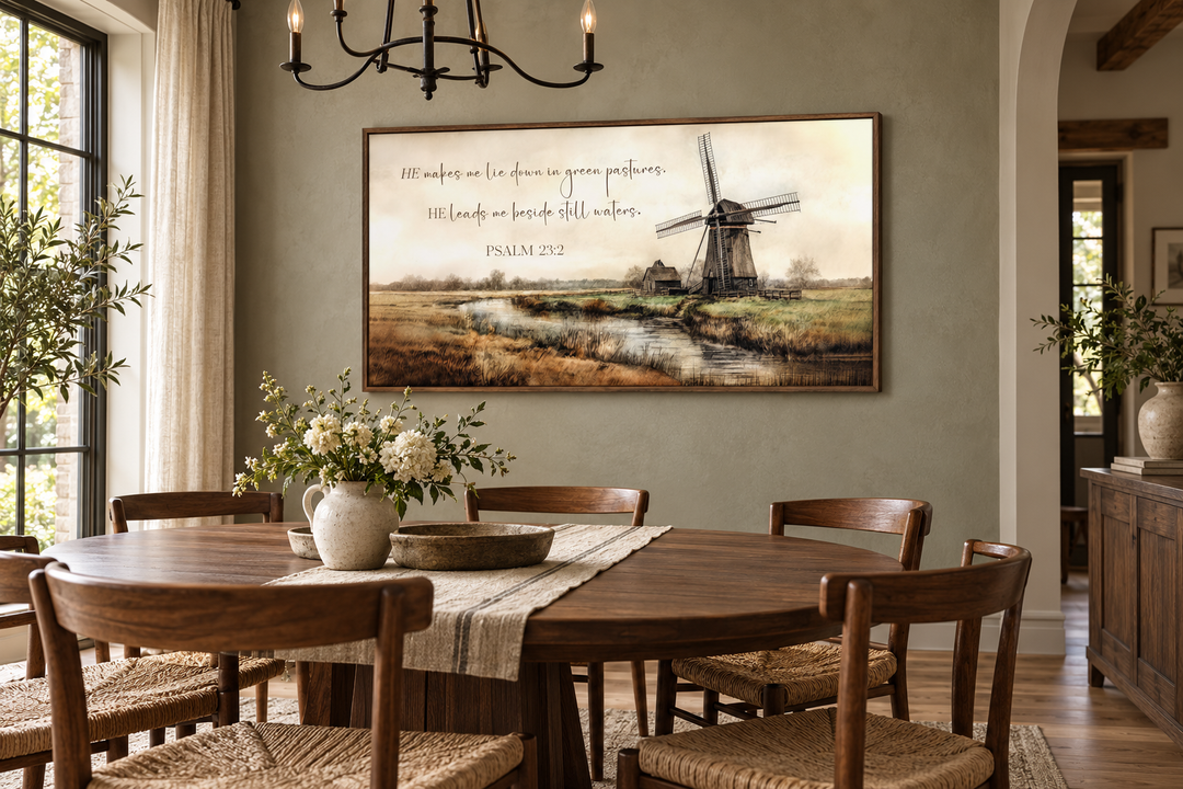 Psalm 23:2 scripture wall art with a windmill landscape in a rustic dining room.