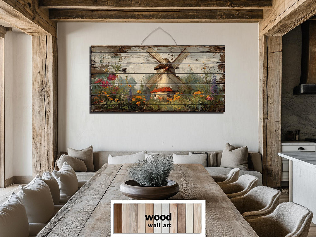 Horizontal wood wall art of a Dutch windmill and wildflowers in a rustic farmhouse dining room.