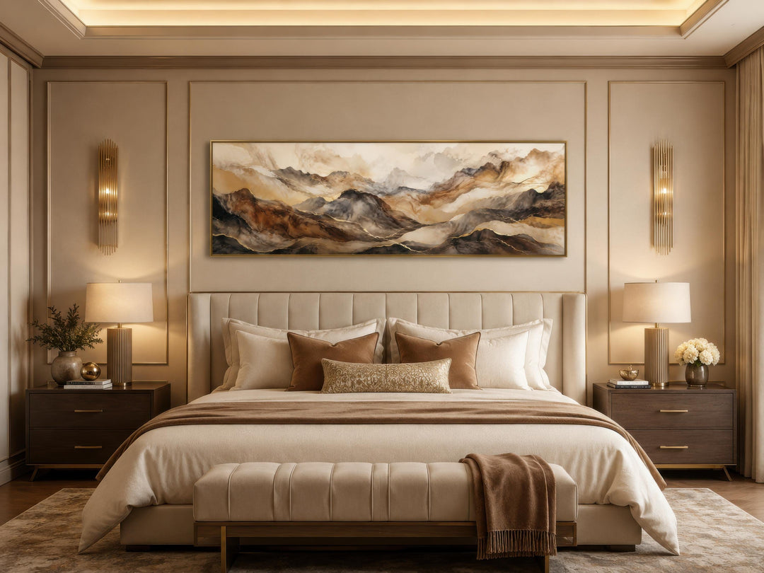 Long horizontal canvas art featuring abstract brown and gold mountain peaks above a neutral bed.
