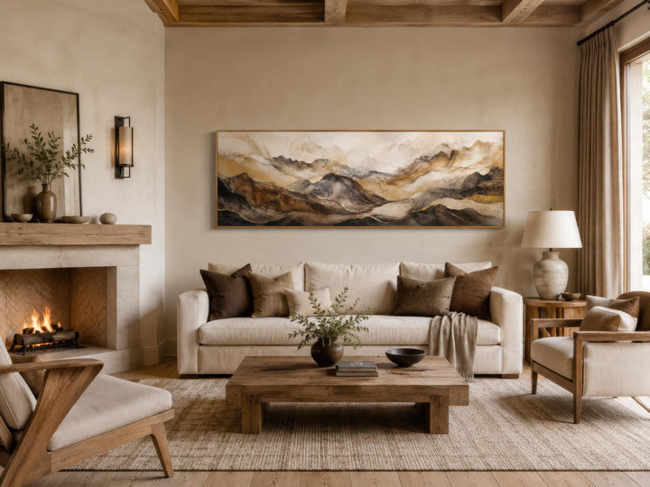 Long horizontal abstract canvas art featuring layered mountains in earthy brown and gold tones.