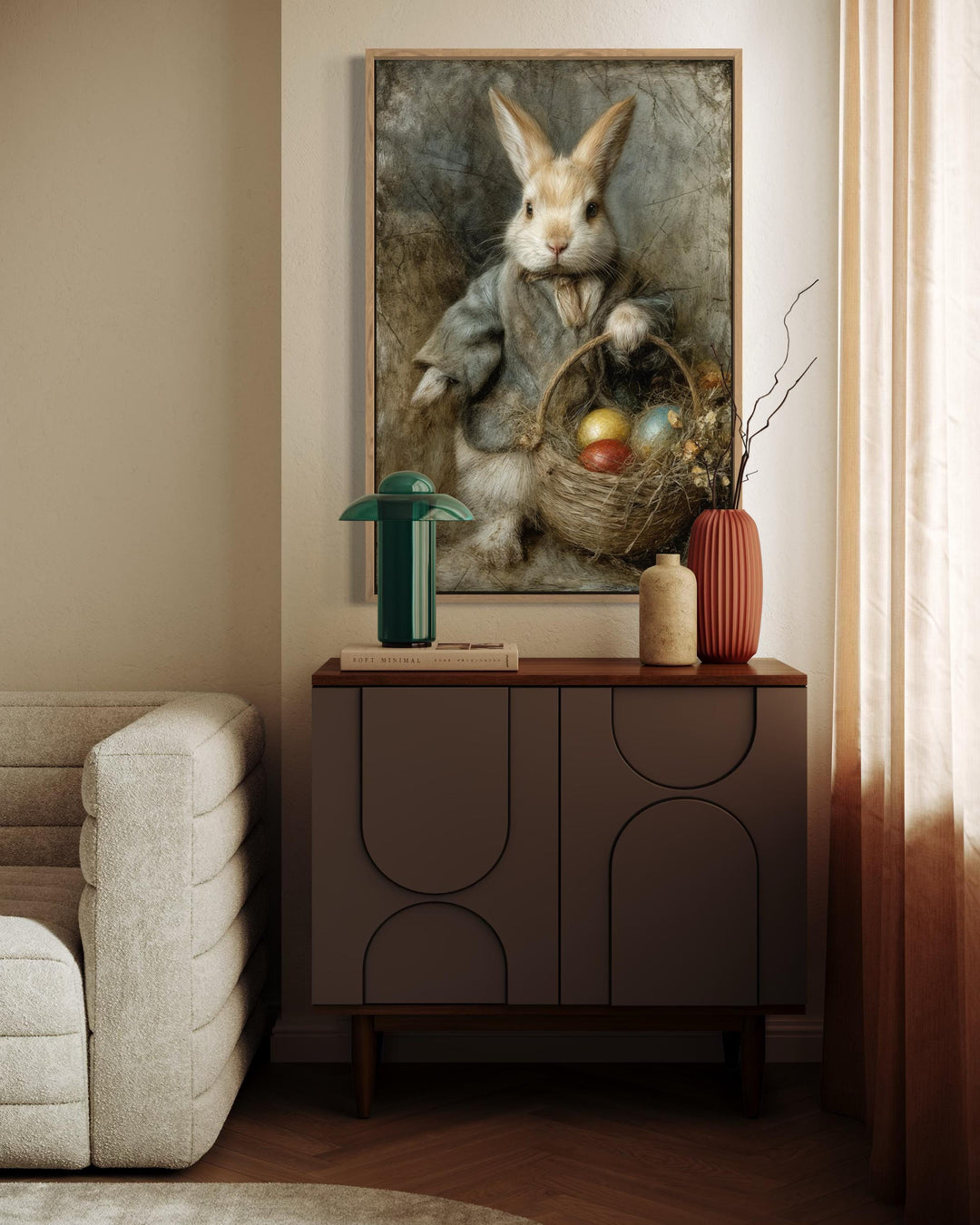 Vintage rabbit painting in a wooden frame above a modern sideboard with Easter decor.