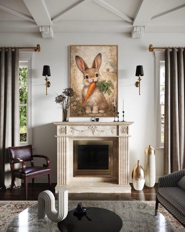 A vertical canvas print of a neutral-toned bunny holding a carrot hangs above a classic fireplace.