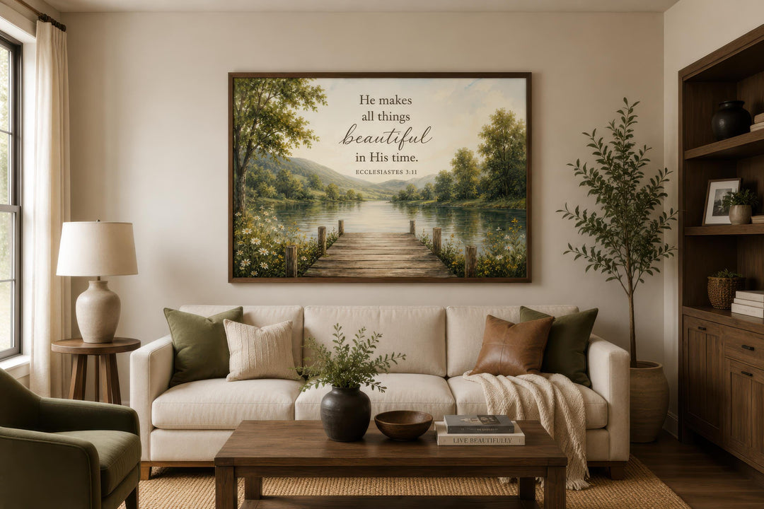 Ecclesiastes 3:11 scripture on rustic canvas wall art above a sofa in a warm, neutral living room.