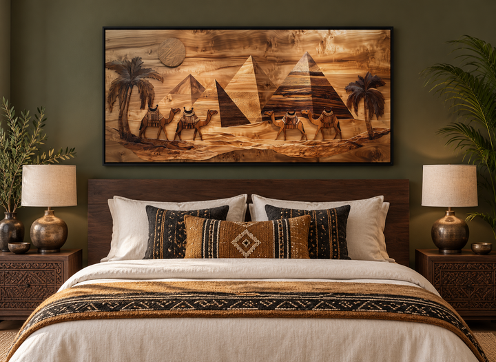 Egypt wall art canvas print with wood texture style of camels and pyramids above a bed.