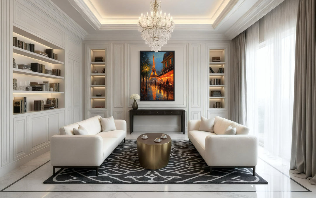 Framed canvas wall art of the Eiffel Tower and a Parisian street cafe at night in a white room.