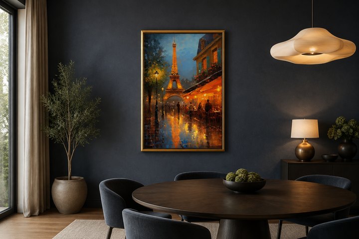 Framed canvas wall art of the Eiffel Tower and a Paris street cafe at night in a dining room.