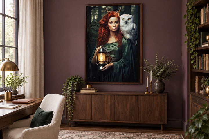 Framed canvas art of Elen of the Ways, a red-haired antlered goddess with a white owl and lantern.