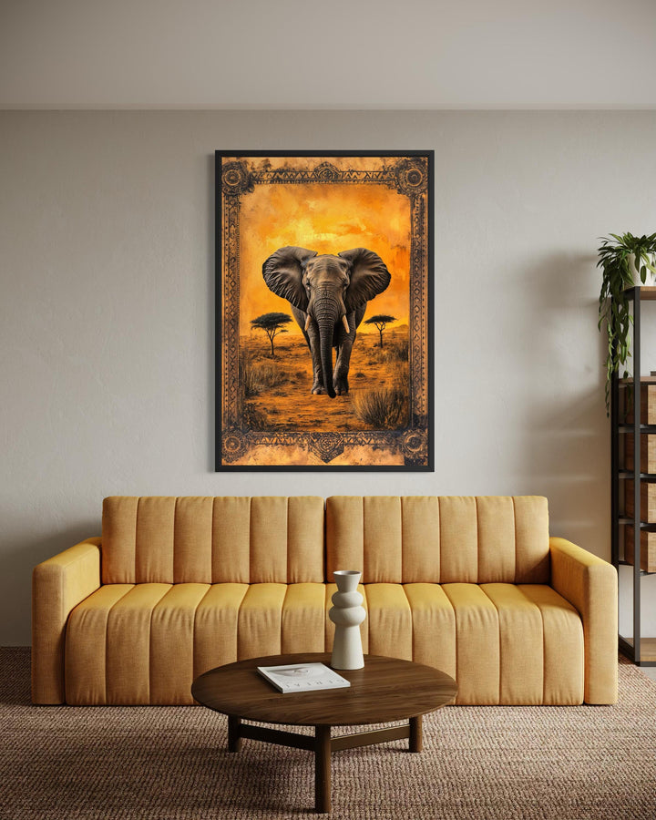 Elephant in African savanna at sunset canvas wall art hanging above a yellow sofa.
