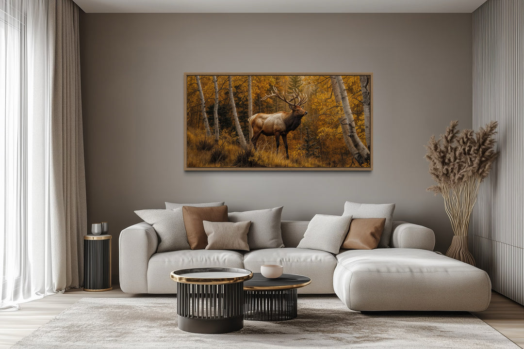 Elk in Autumn Forest rustic framed canvas wall art hanging above a modern sofa in a living room.