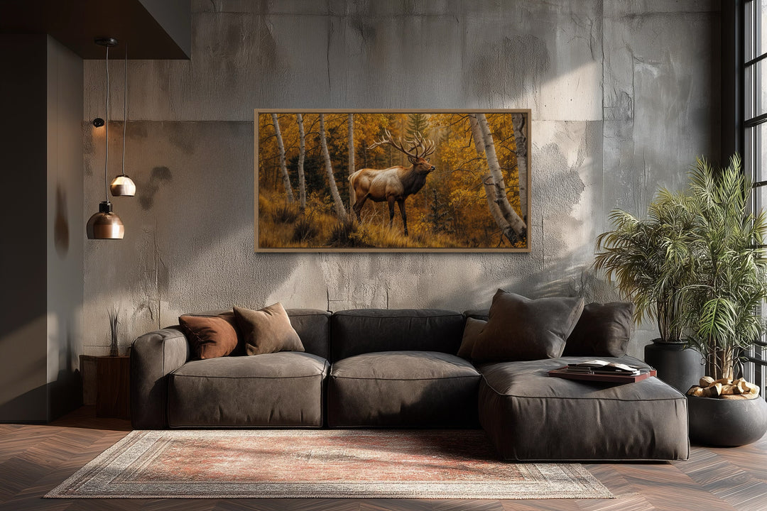 Elk in Autumn Forest rustic framed canvas wall art hanging above a modern sofa in a cabin interior.
