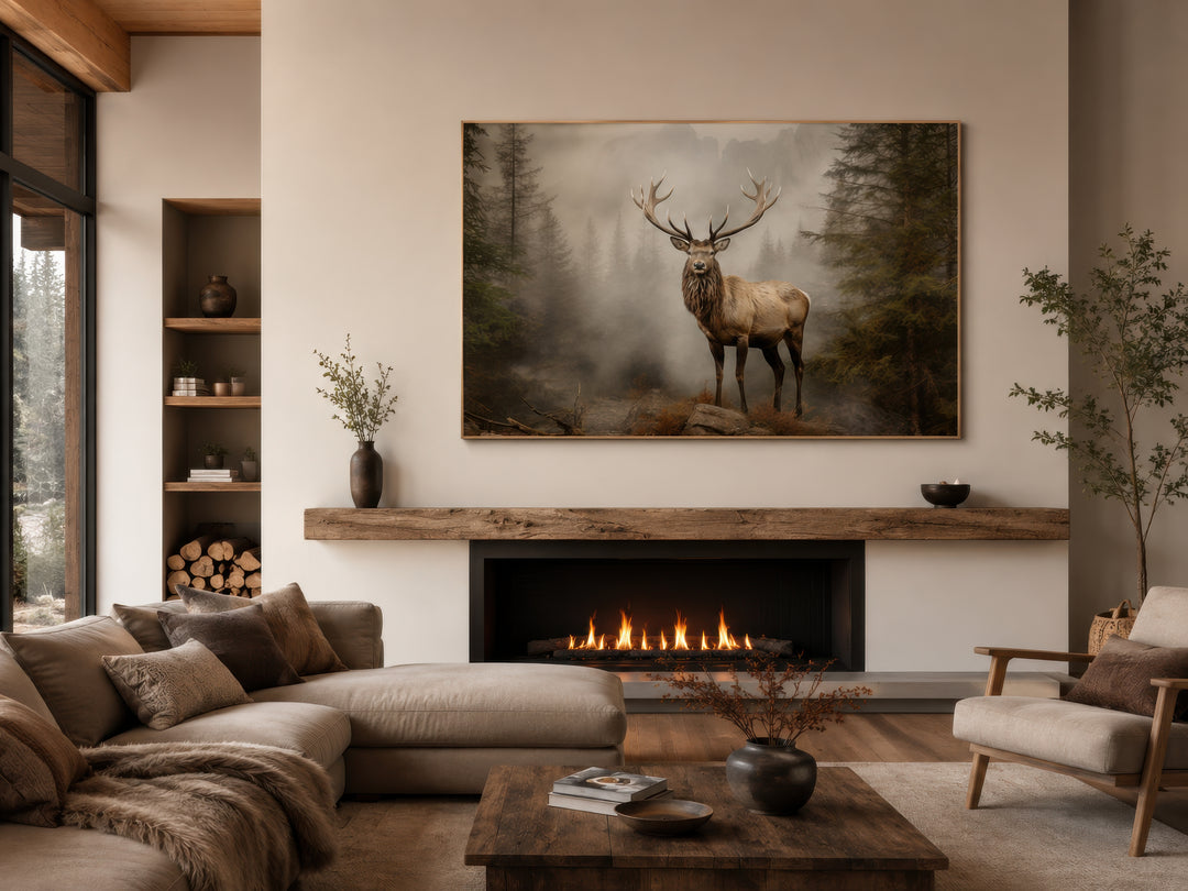 Elk in misty fir forest painting above a fireplace in a rustic living room with a cozy sofa.
