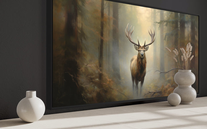Large framed canvas wall art of a majestic elk in a foggy forest, displayed in a rustic room.