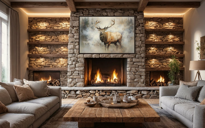 Elk in smokey forest canvas wall art hanging above a stone fireplace in a rustic living room.