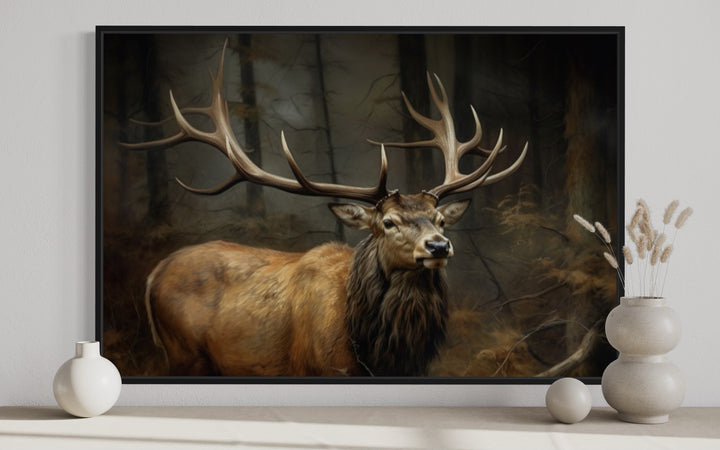 Framed canvas wall art of a majestic elk with large antlers in a dark, dense forest setting.