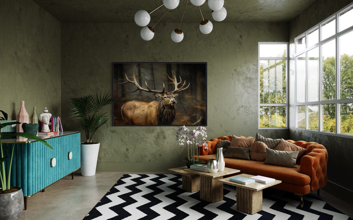 Elk with big antlers in a forest framed canvas wall art hanging in a modern living room.