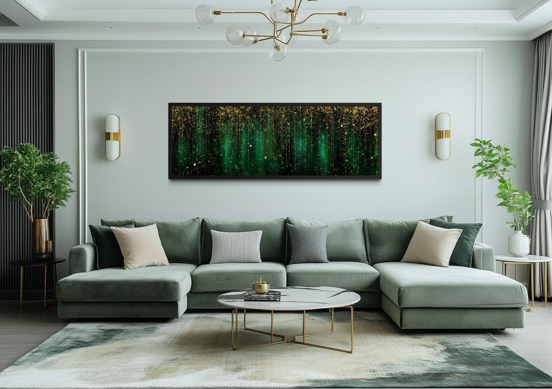 Emerald green and gold abstract rain pattern canvas wall art displayed above a modern green sofa.