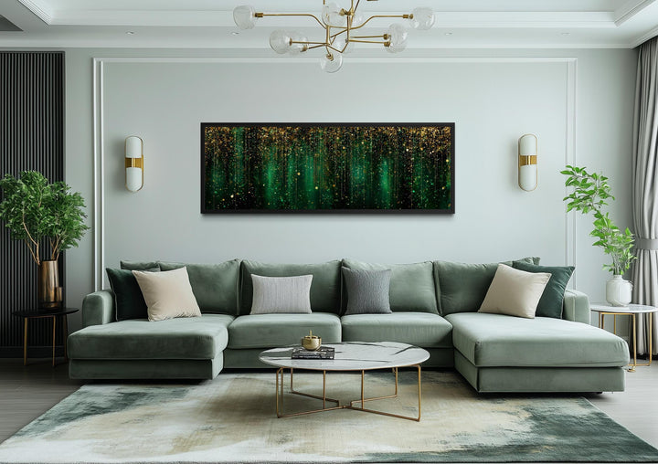 Emerald green and gold abstract rain pattern canvas wall art displayed above a modern green sofa.