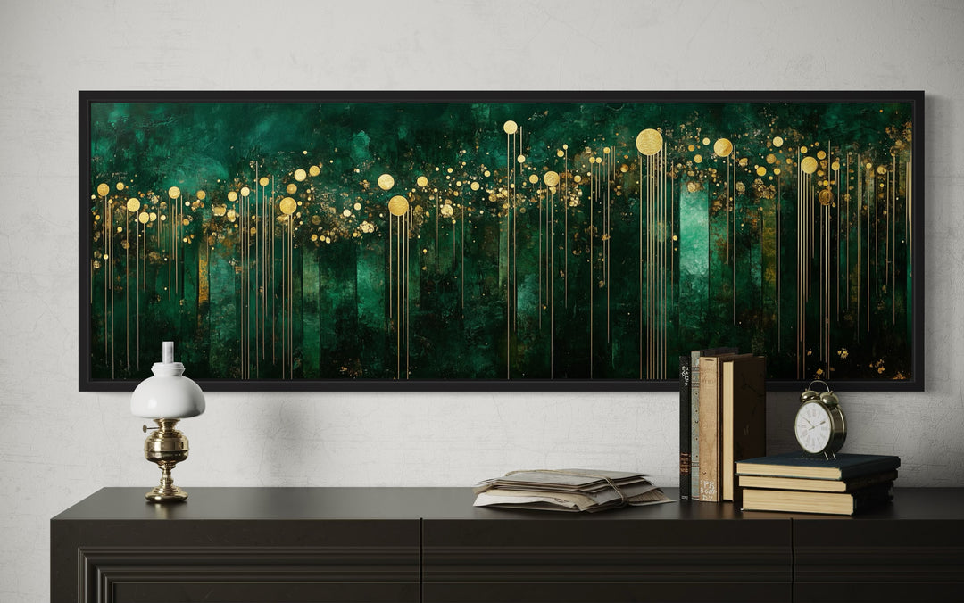 Emerald green and gold art deco framed canvas wall art displayed above a dark sideboard.