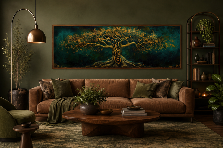 Emerald green and gold Yggdrasil tree framed canvas wall art hanging above a brown leather sofa.