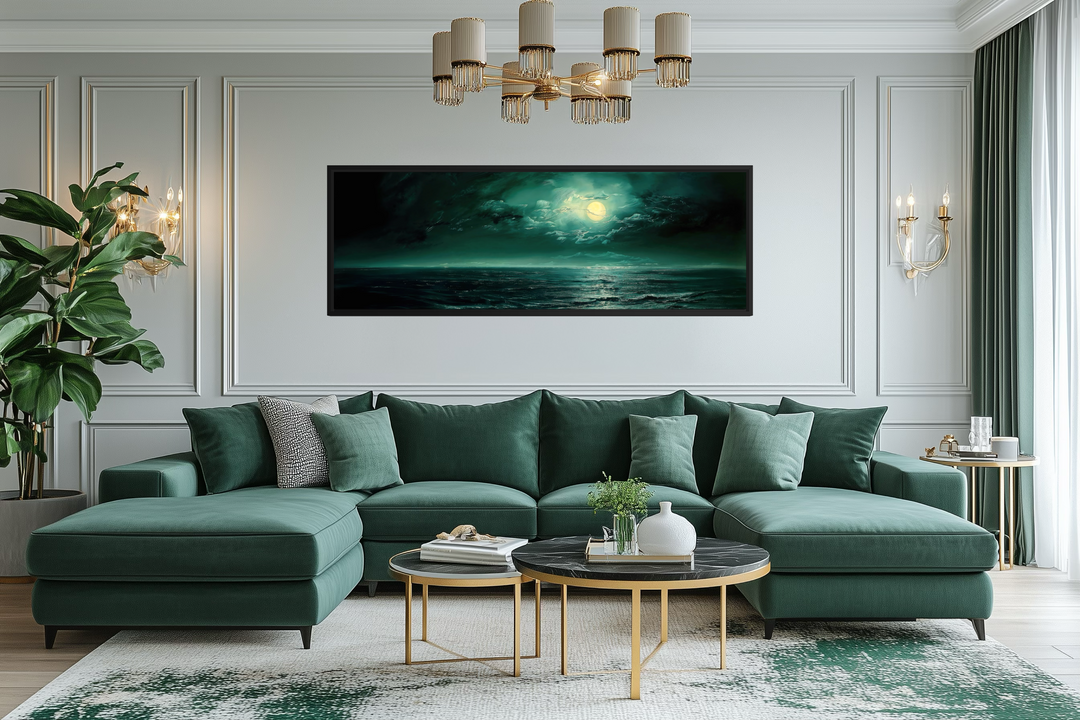 Emerald green ocean seascape wall art with a glowing moon over a modern green sectional sofa.
