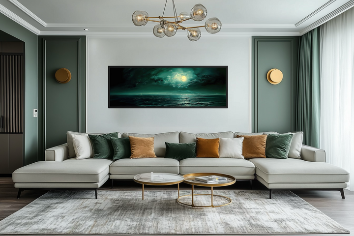 Panoramic emerald green ocean seascape wall art with a glowing moon above a modern sofa.
