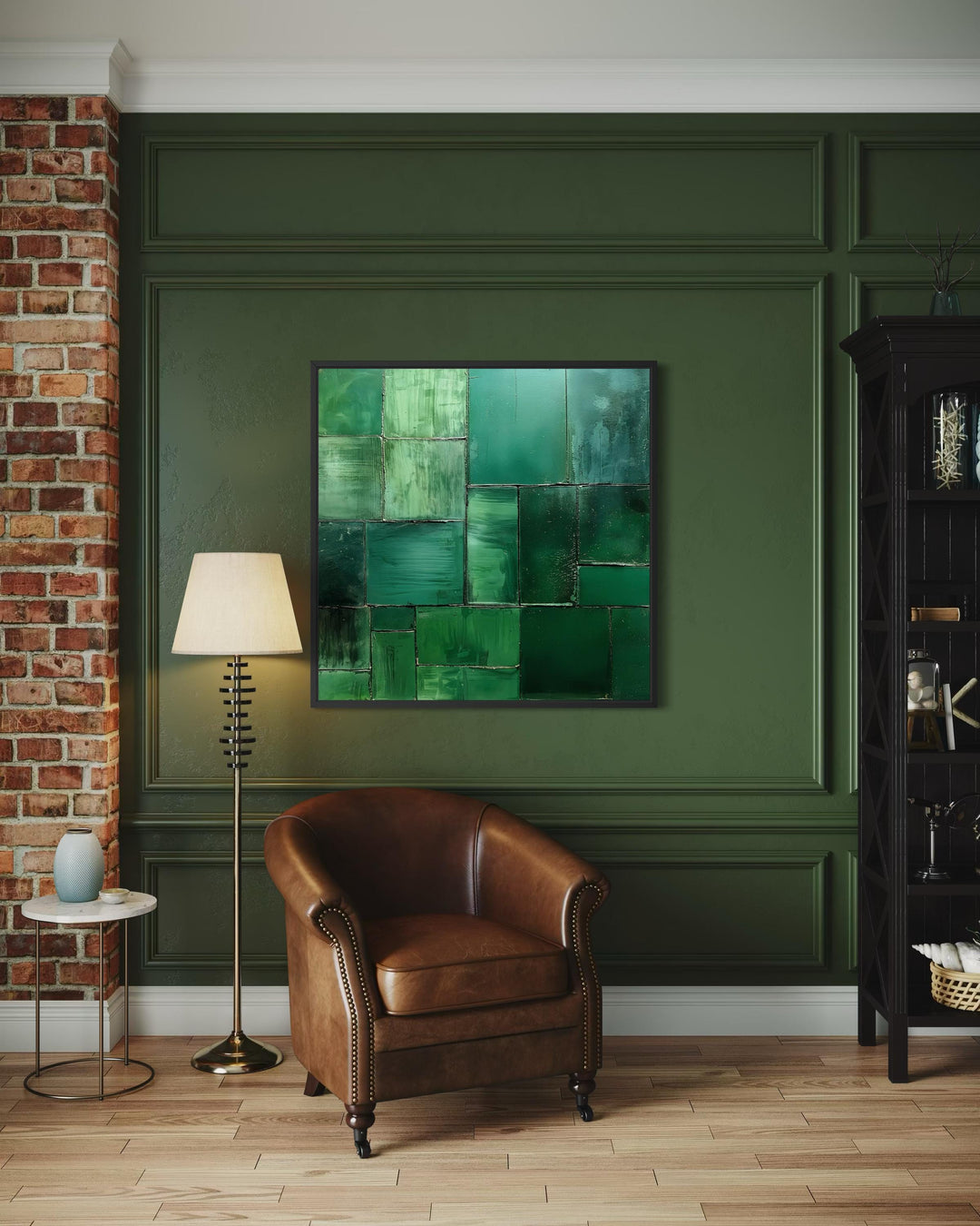 Square emerald green geometric abstract painting on a dark green paneled wall above a leather chair.
