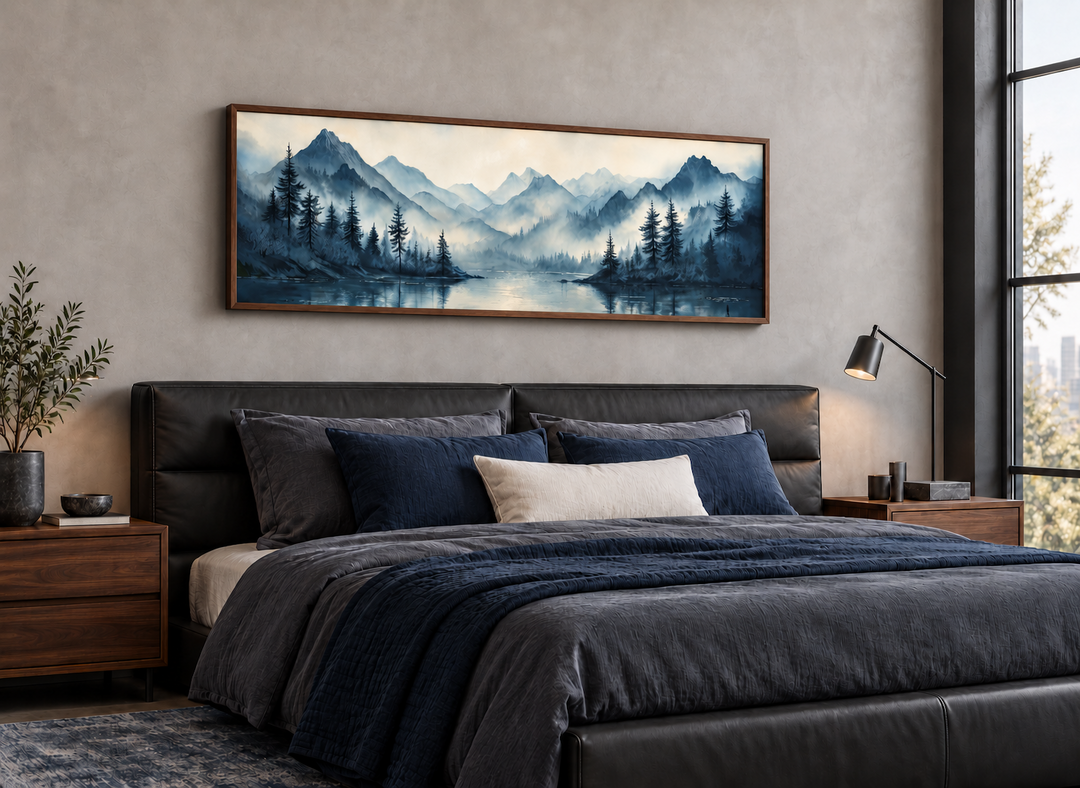 Navy blue mountain lake landscape long horizontal framed canvas wall art hanging above a bed.