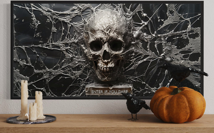 Skeleton skull wall art with spiderwebs and "Enter If You Dare" text on a wooden shelf.