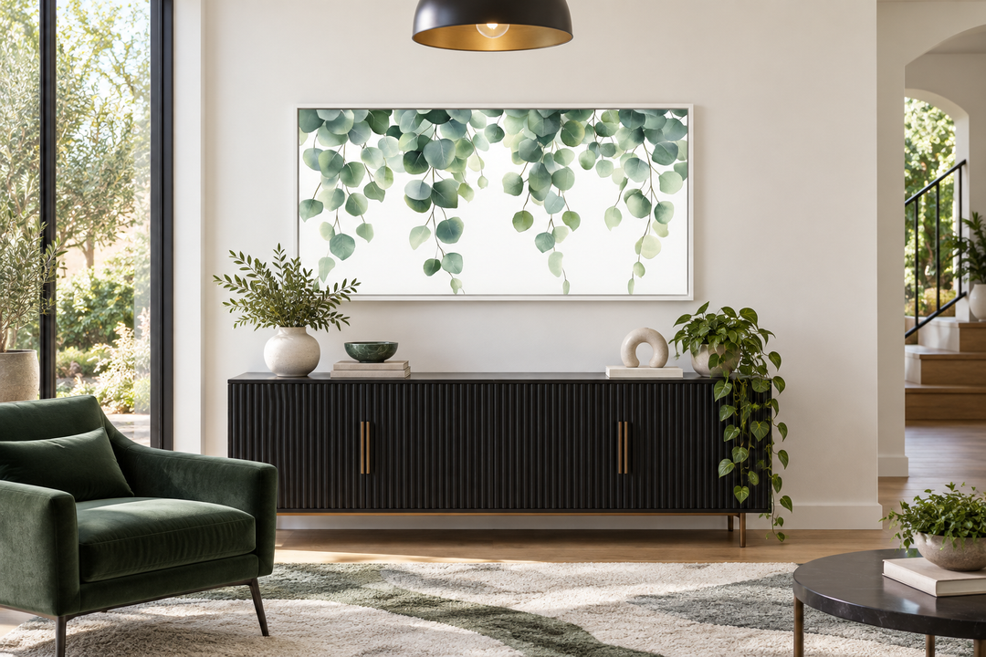 Horizontal framed canvas wall art featuring cascading sage green eucalyptus leaves.