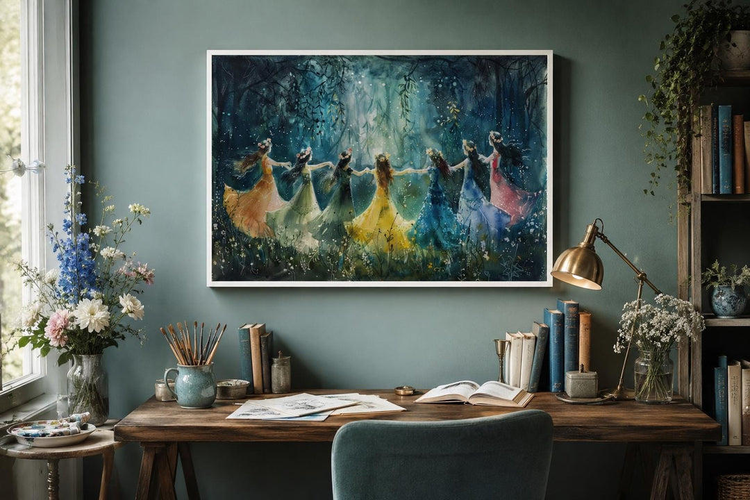 Fairies dancing in a circle in an enchanted forest wall art above a wooden desk.