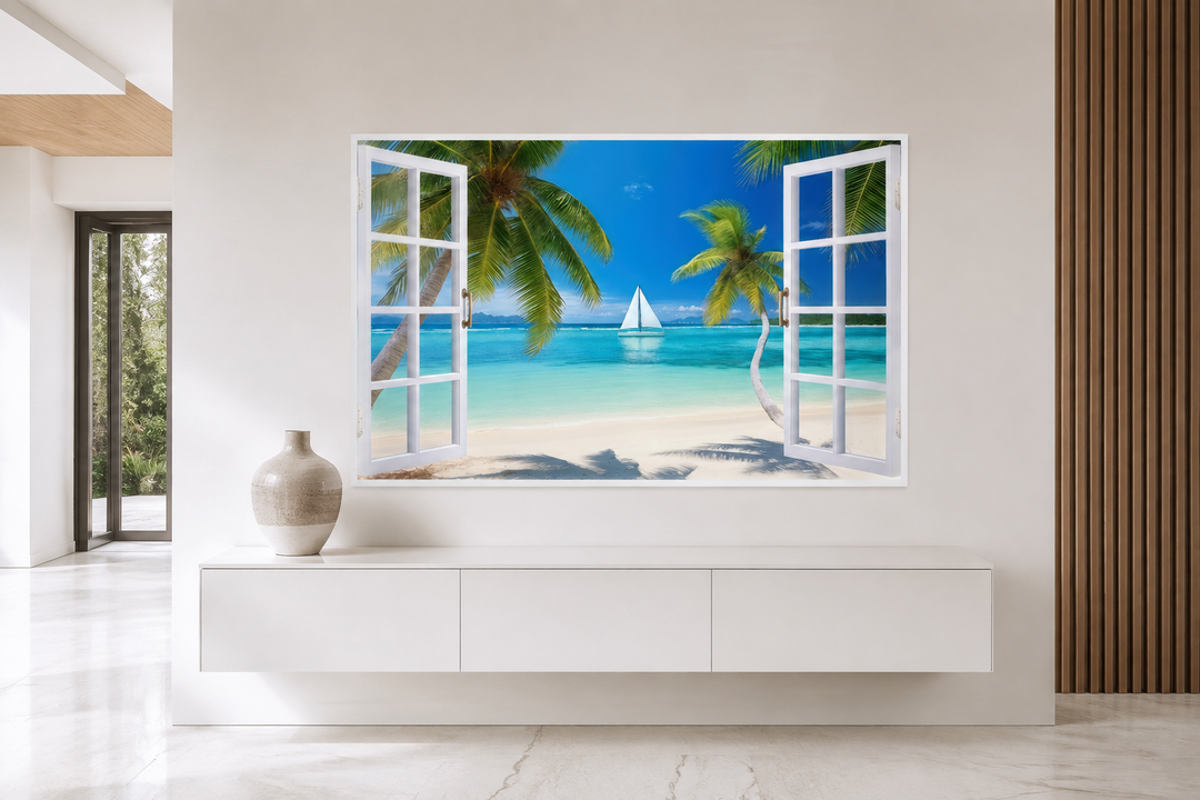 Caribbean beach and sailboat open window view wall art on a white wall above a modern cabinet.