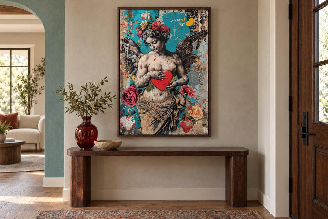 Fallen Angel Graffiti Modern Wall Art featuring a winged figure holding a red heart on a blue wall.