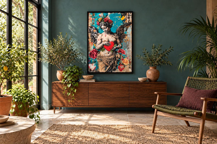 Fallen Angel Graffiti Modern Wall Art in a black frame above a wooden sideboard in a green room.