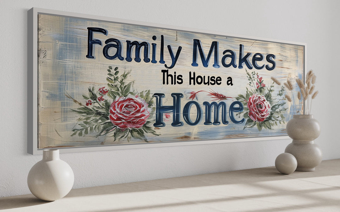 Framed canvas wall art with the text "Family Makes This House a Home" and floral rose accents.