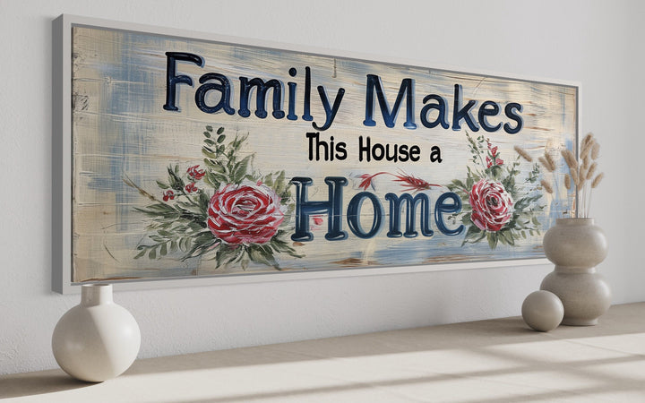 Framed canvas wall art with the text "Family Makes This House a Home" and floral rose accents.