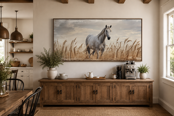 Farm horse in a wheat field framed canvas wall art above a rustic wooden sideboard.